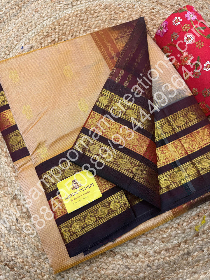 Biscuit with Brown  , rich Zari Podi Kattam with Mango butta in the body , traditional Kanchi border and rich Pallu Korvai Silk Cotton Saree