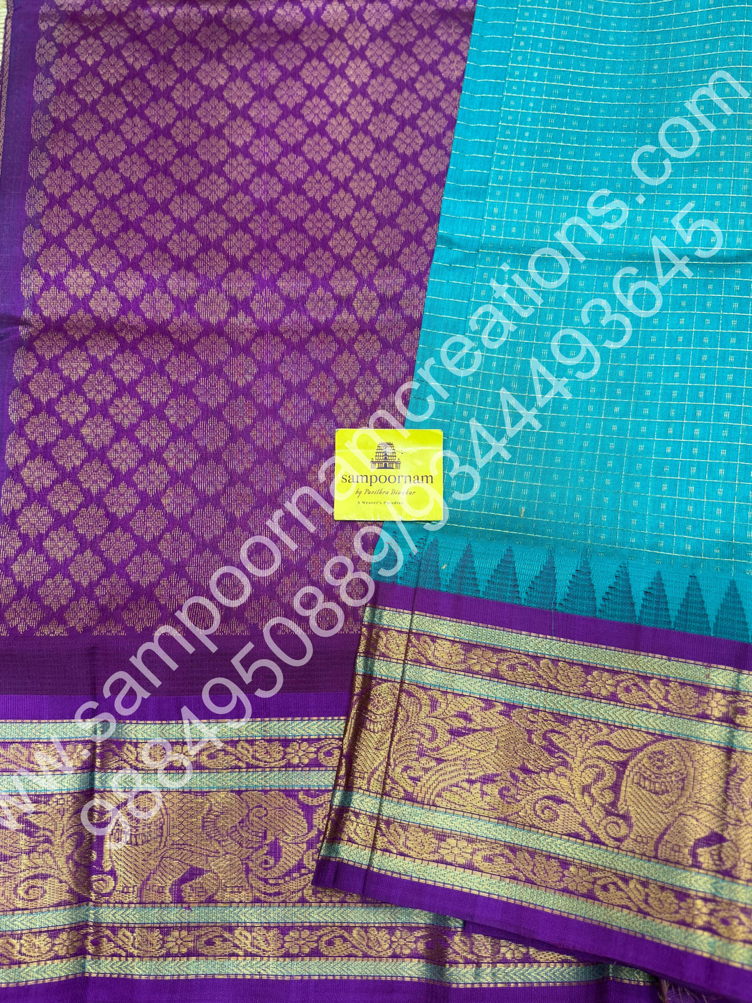 Ocean Blue with Purple , rich traditional borders and Lakshadeepam Zari Buttas all over the body and Grand Pallu Korvai Silk Cotton Saree