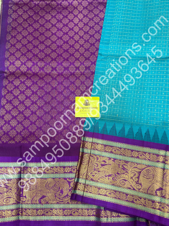Ocean Blue with Purple , rich traditional borders and Lakshadeepam Zari Buttas all over the body and Grand Pallu Korvai Silk Cotton Saree