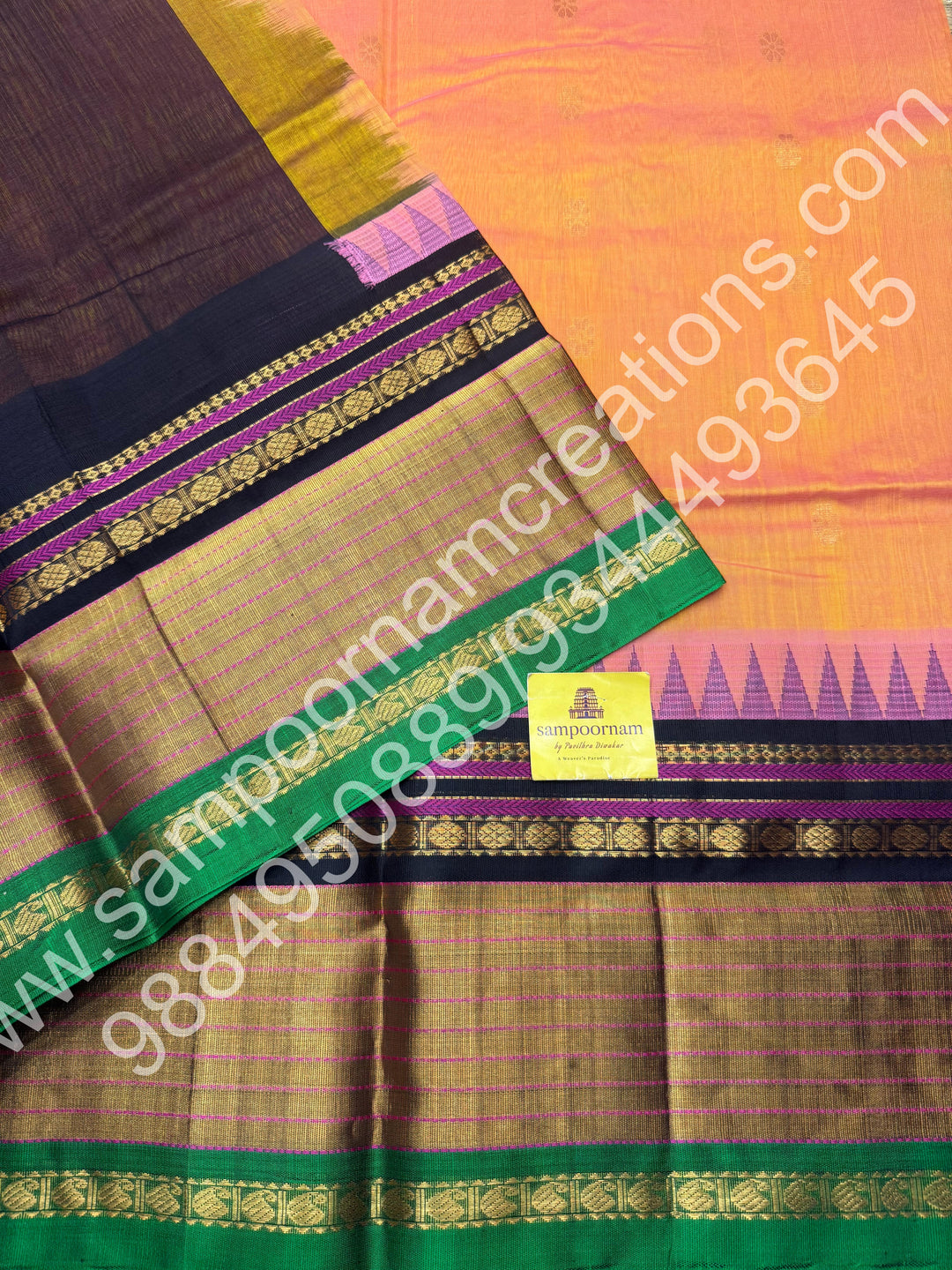 Peach with Black , rich floral Zari butta in the body , One side Long border and  Grand Pallu Korvai Silk Cotton Saree