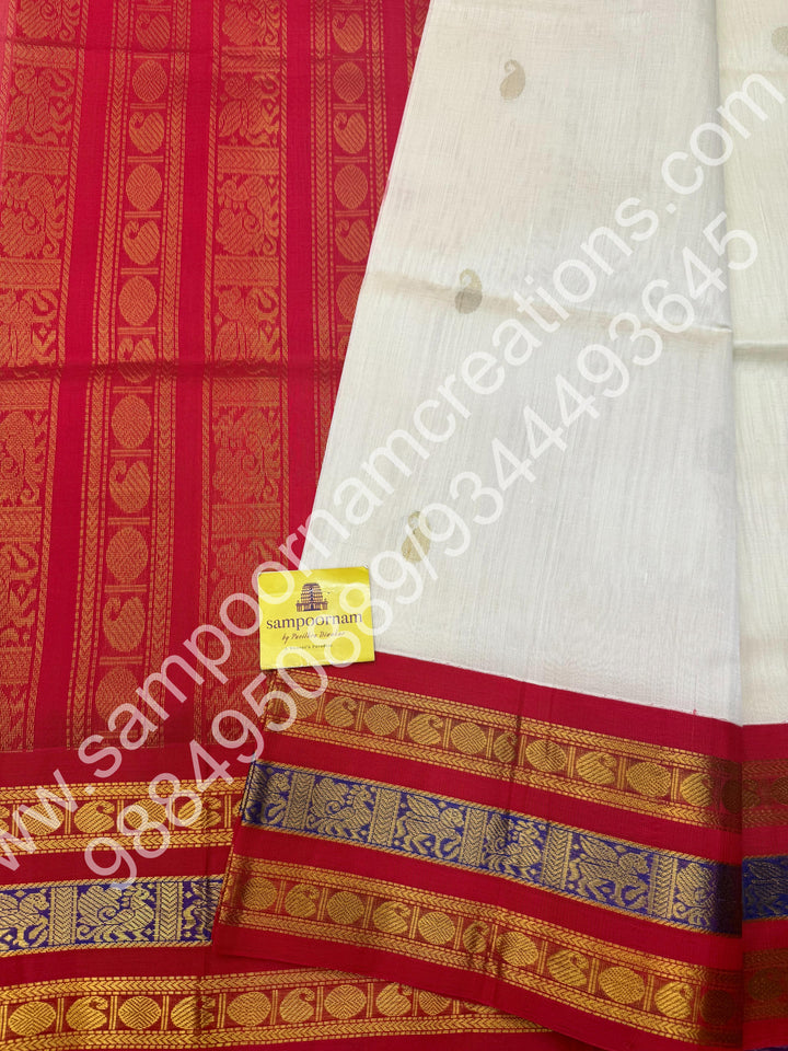 Cream with Red , rich Mango and Rudraksh Zari butta in the body , traditional Kanchi Borders , rich traditional borders and Grand Pallu Korvai Silk Cotton Saree