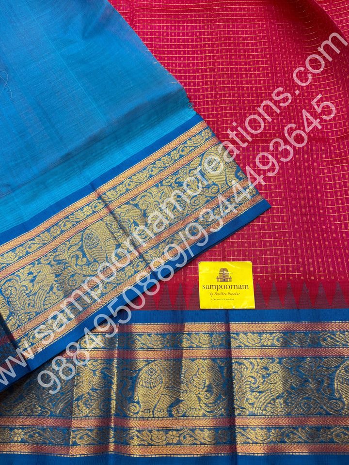 Hot Pink with Ramar Blue , rich traditional borders and Lakshadeepam Zari Buttas all over the body and Grand Pallu Korvai Silk Cotton Saree