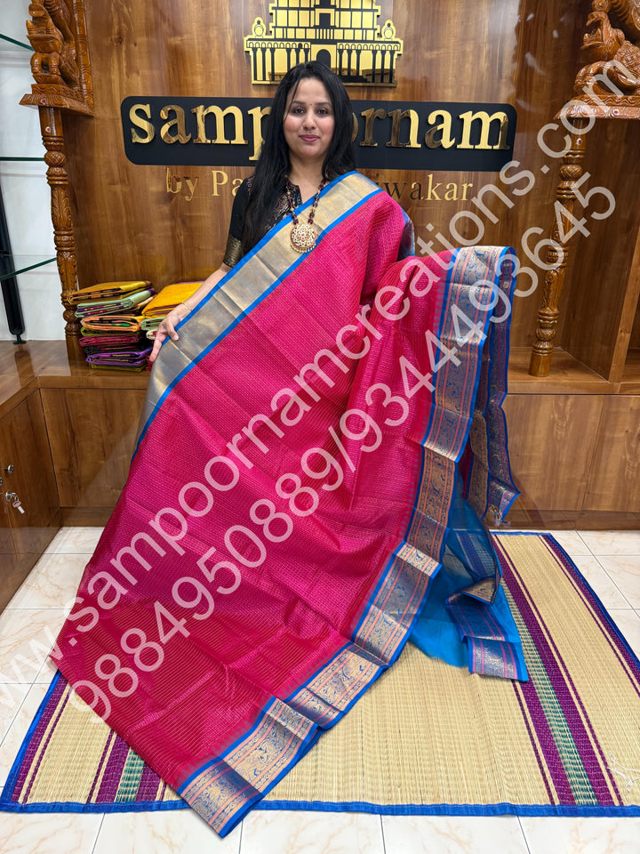 Hot Pink with Ramar Blue , rich traditional borders and Lakshadeepam Zari Buttas all over the body and Grand Pallu Korvai Silk Cotton Saree