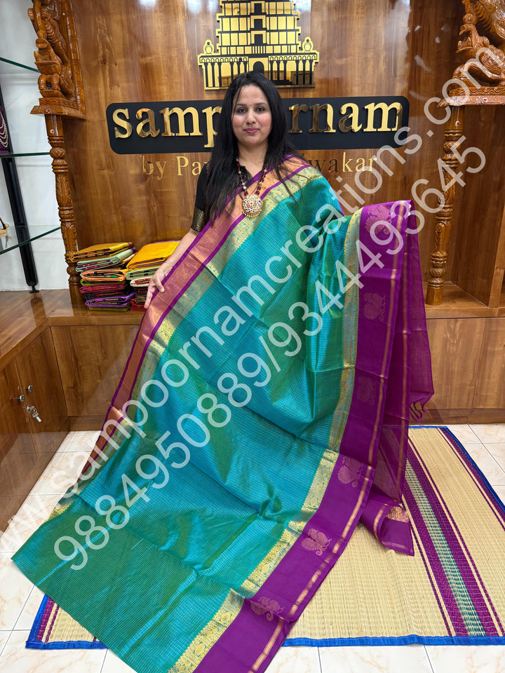 Ocean Teal with Purple  , rich Zari Kattam in the body , traditional Annam motif  border and rich Pallu Korvai Silk Cotton Saree