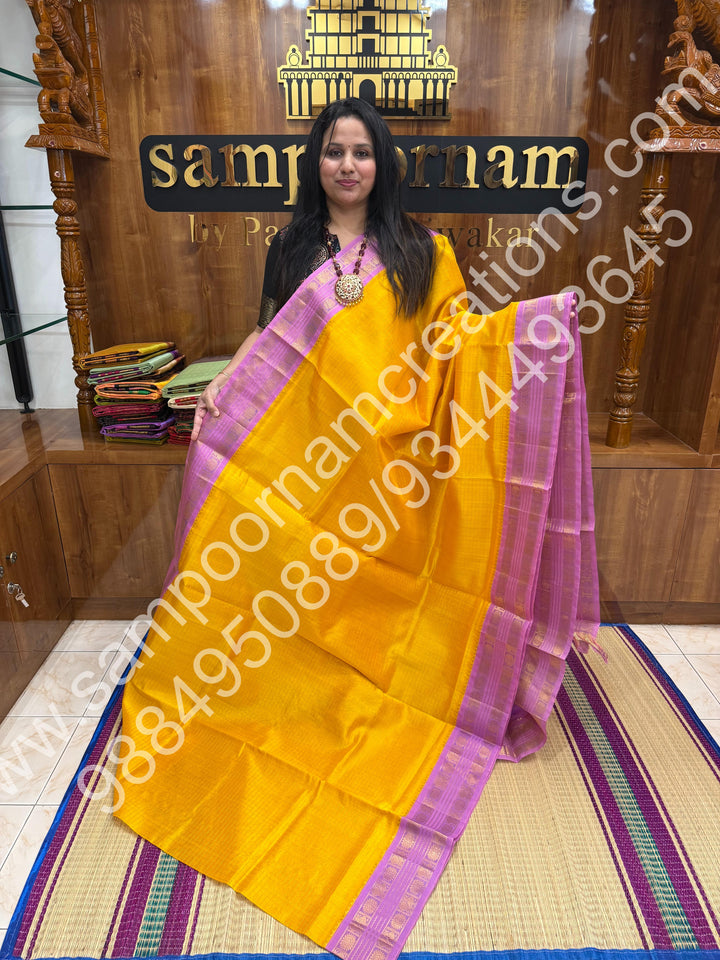 Turmeric Yellow with Lavender , rich Zari Kattam in the body , traditional border and rich Pallu Korvai Silk Cotton Saree