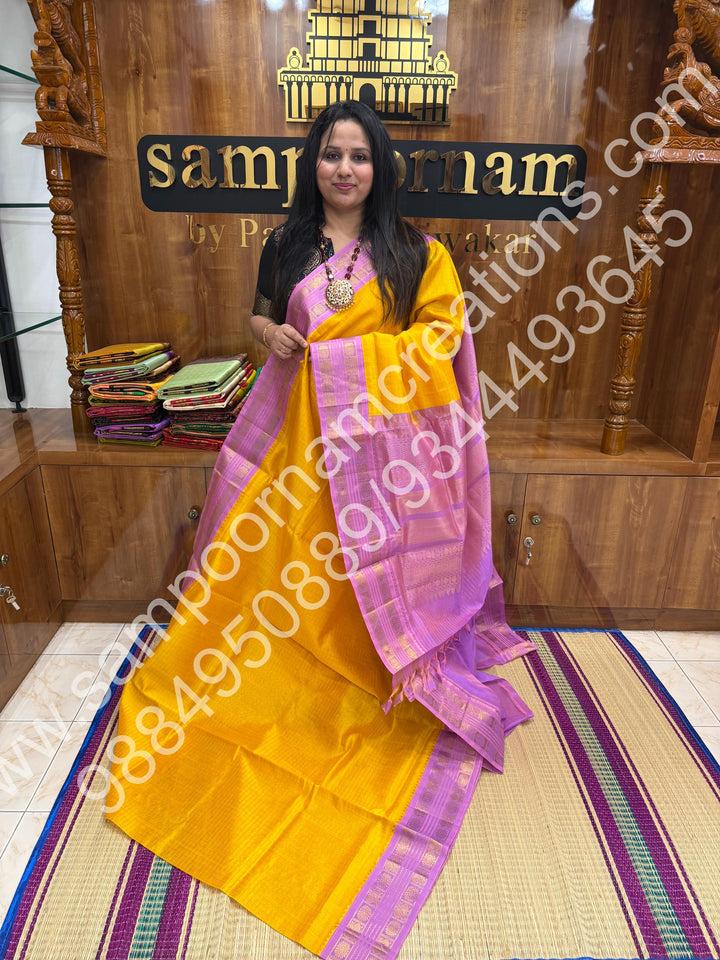 Turmeric Yellow with Lavender , rich Zari Kattam in the body , traditional border and rich Pallu Korvai Silk Cotton Saree