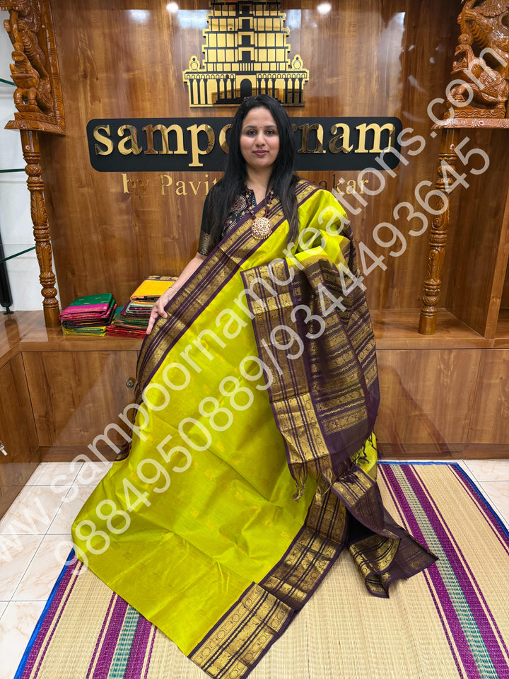 Manthulir with Dark Brown , Rich Annam Zari butta in the body , traditional Kanchi Borders and Grand Pallu Korvai Silk Cotton Saree