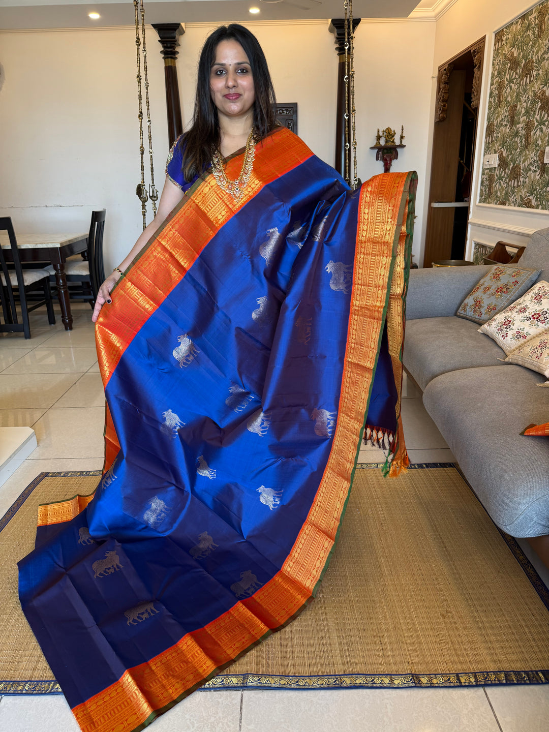 Cobalt Blue with Fanta orange, Gomatha and Kannukutty Zari Rich Butta all over the body , traditional Kanchi border and rich Pallu Korvai Pure Kanjivaram Silk saree