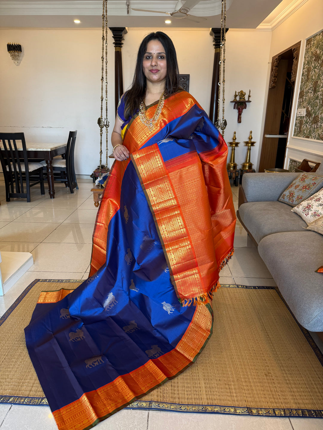 Cobalt Blue with Fanta orange, Gomatha and Kannukutty Zari Rich Butta all over the body , traditional Kanchi border and rich Pallu Korvai Pure Kanjivaram Silk saree