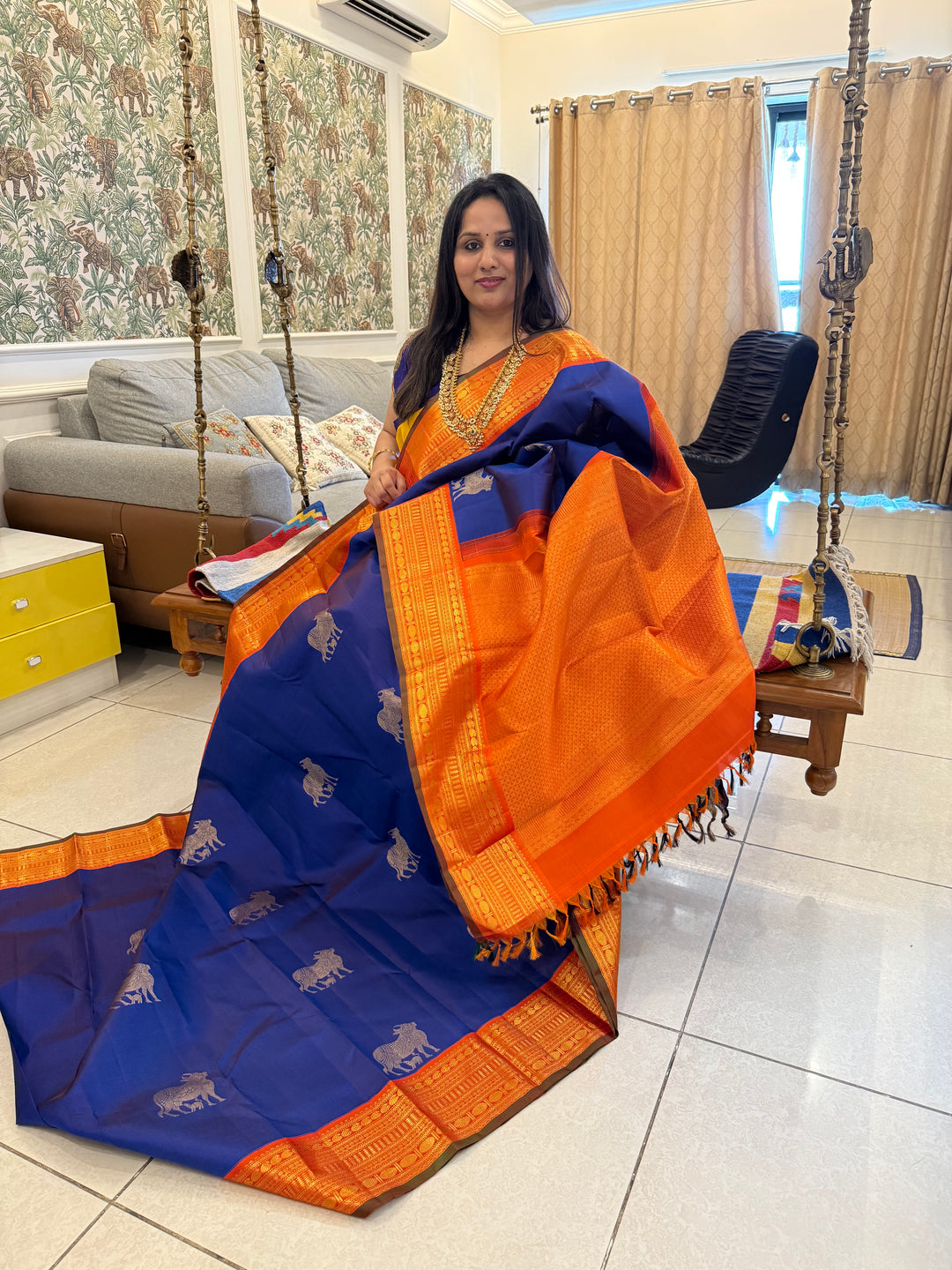 Cobalt Blue with Fanta orange, Gomatha and Kannukutty Zari Rich Butta all over the body , traditional Kanchi border and rich Pallu Korvai Pure Kanjivaram Silk saree