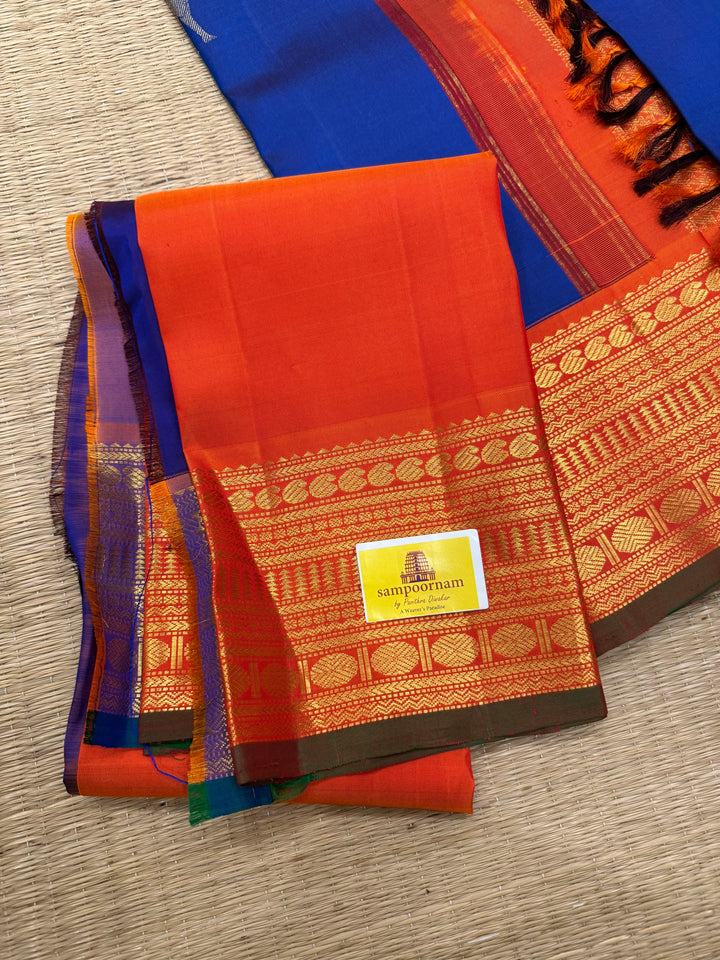 Cobalt Blue with Fanta orange, Gomatha and Kannukutty Zari Rich Butta all over the body , traditional Kanchi border and rich Pallu Korvai Pure Kanjivaram Silk saree