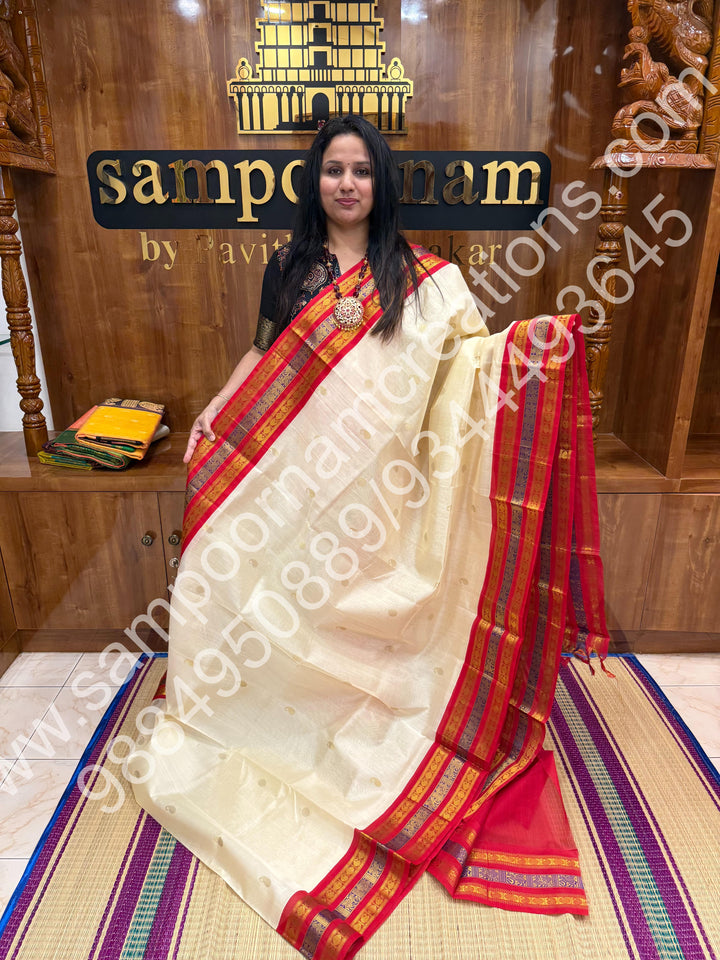 Cream with Red , rich Mango and Rudraksh Zari butta in the body , traditional Kanchi Borders , rich traditional borders and Grand Pallu Korvai Silk Cotton Saree
