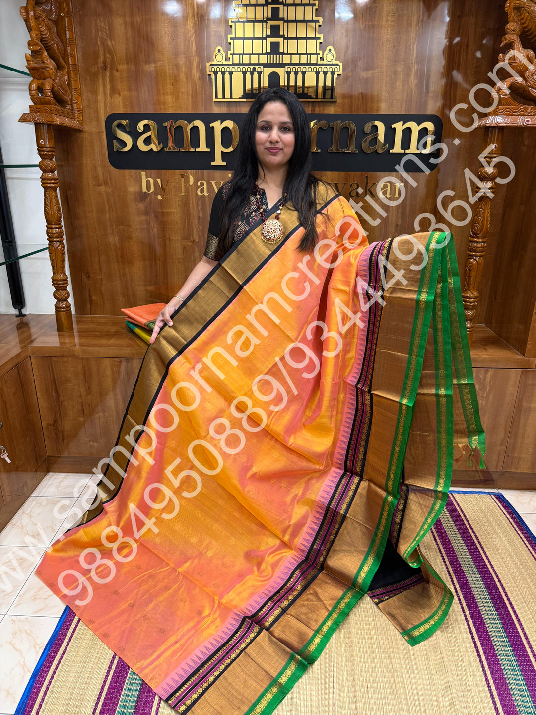 Peach with Black , rich floral Zari butta in the body , One side Long border and  Grand Pallu Korvai Silk Cotton Saree