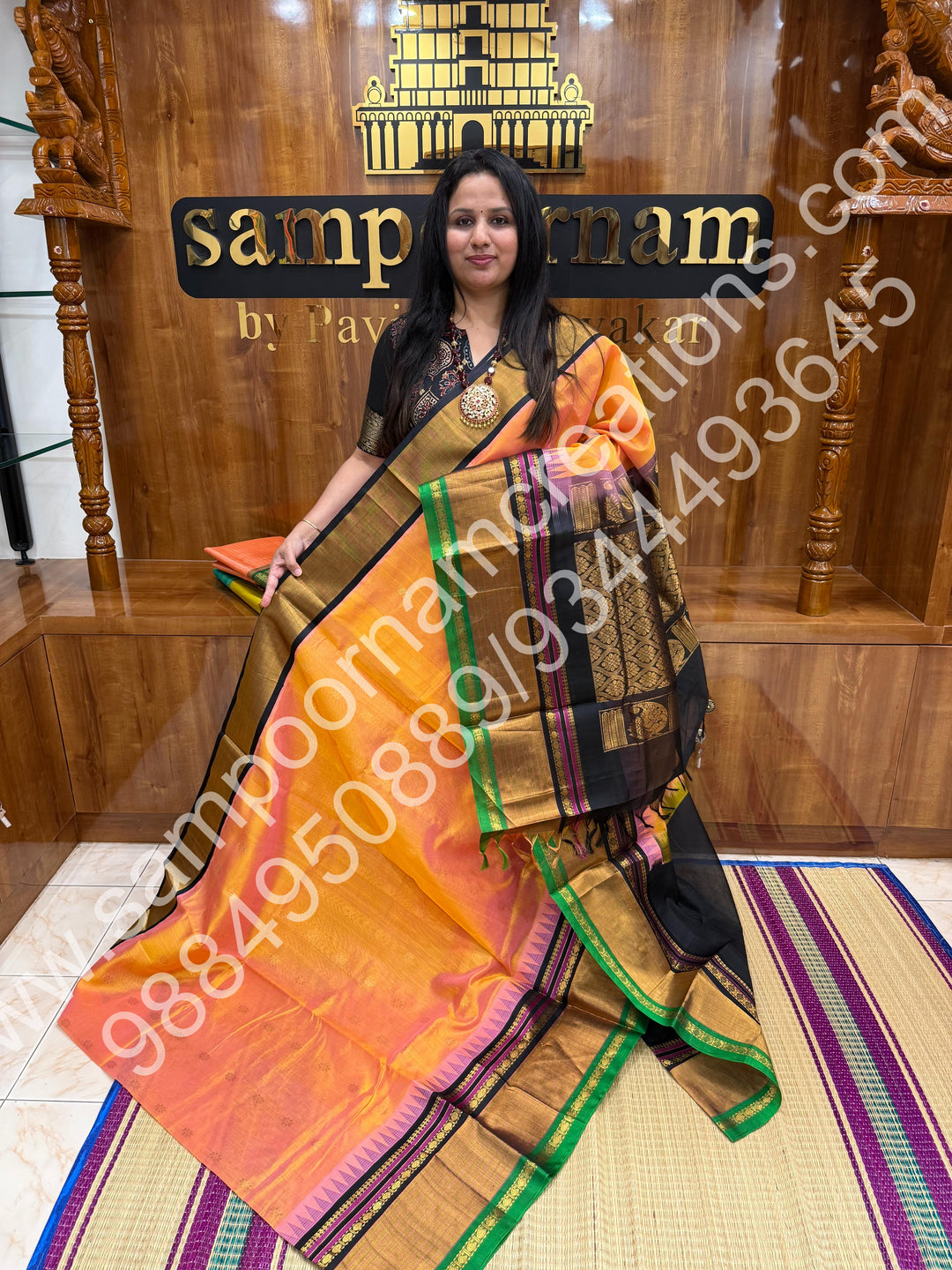Peach with Black , rich floral Zari butta in the body , One side Long border and  Grand Pallu Korvai Silk Cotton Saree