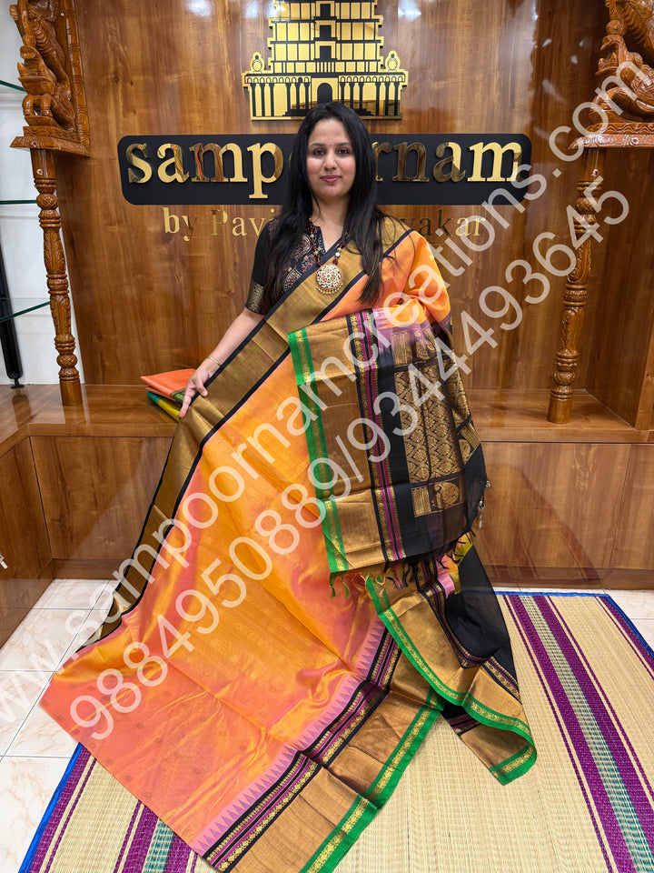 Peach with Black , rich floral Zari butta in the body , One side Long border and  Grand Pallu Korvai Silk Cotton Saree