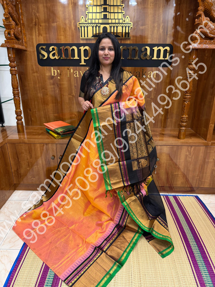Peach with Black , rich floral Zari butta in the body , One side Long border and  Grand Pallu Korvai Silk Cotton Saree