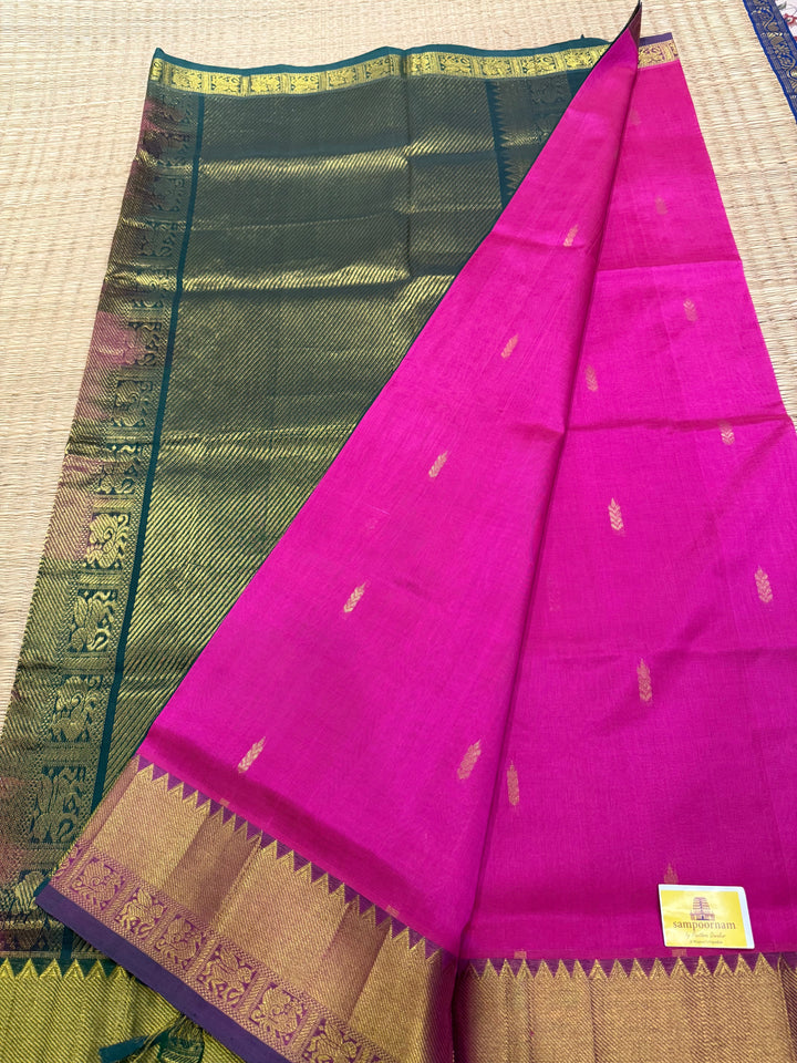 Green with pink rich butta in the body,traditional borders and rich pallu semi silk cotton saree