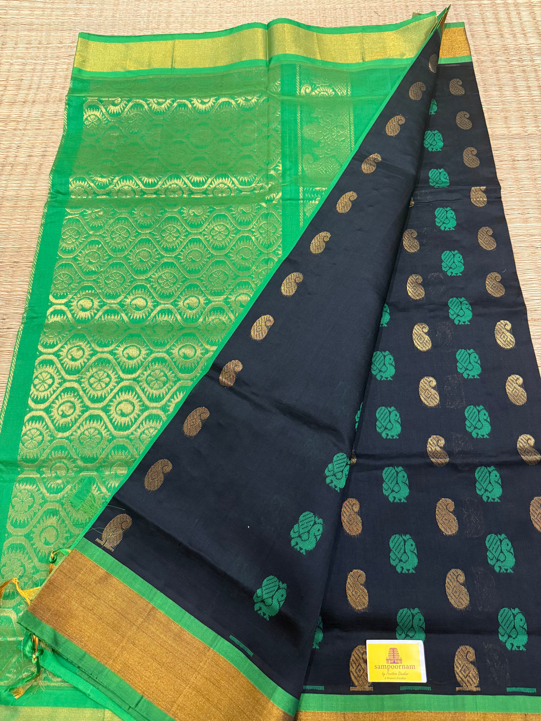 Black with green ,mango and annam rich butta in the body,traditional borders and rich pallu semi silk cotton saree