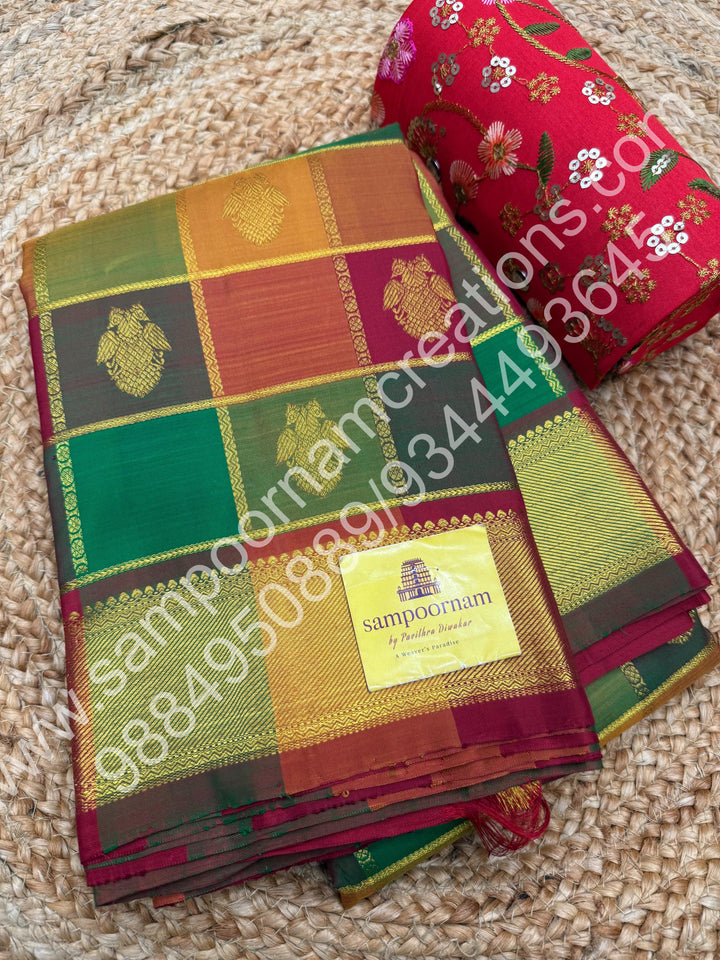 Green , Orange , Mustard and Maroon with Maroon , Rich Two side Peacock butta in the body with Zari checks , Traditional borders and Rich Pallu , Pure Kanjivaram Silk Saree