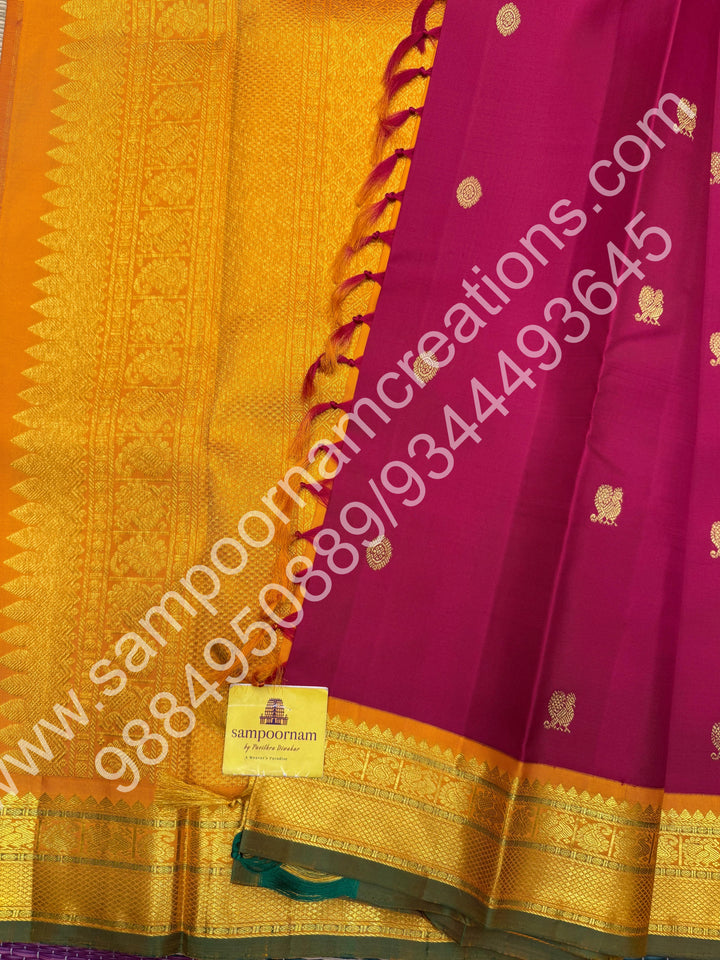 Kumkum Red with Mustard , Rich Mayil and Chakram  butta in the body , Traditional borders and Rich Pallu , Pure Kanjivaram Silk Saree