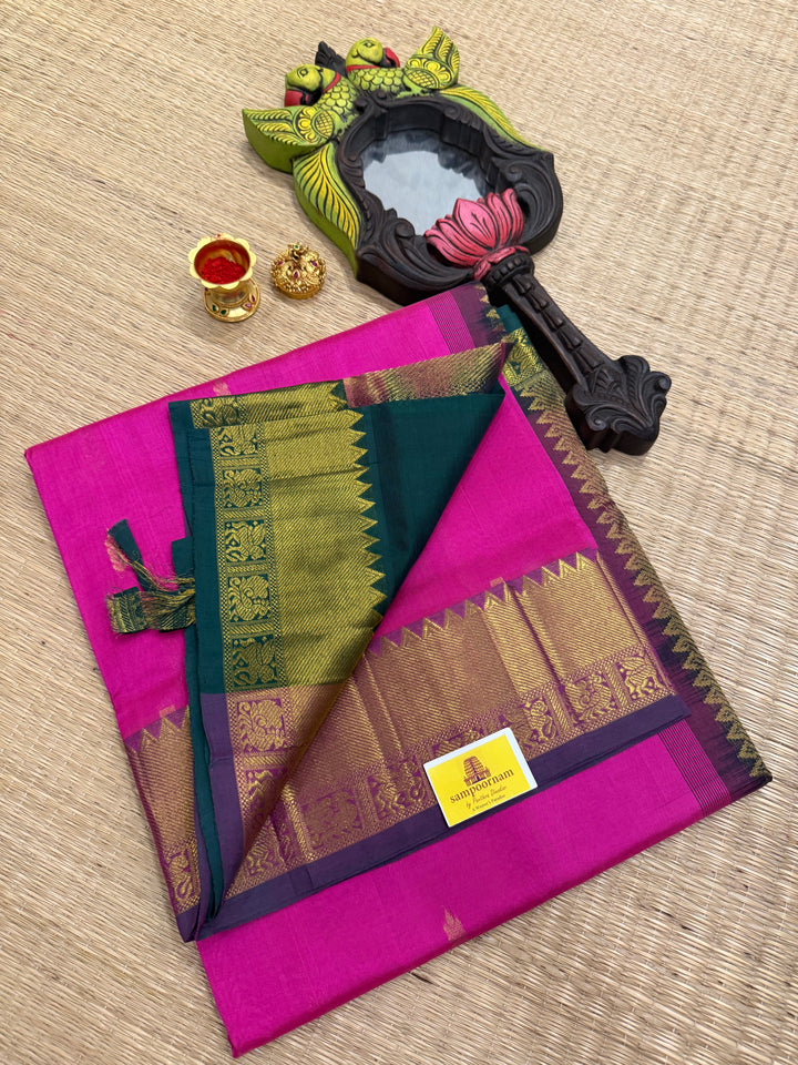 Green with pink rich butta in the body,traditional borders and rich pallu semi silk cotton saree