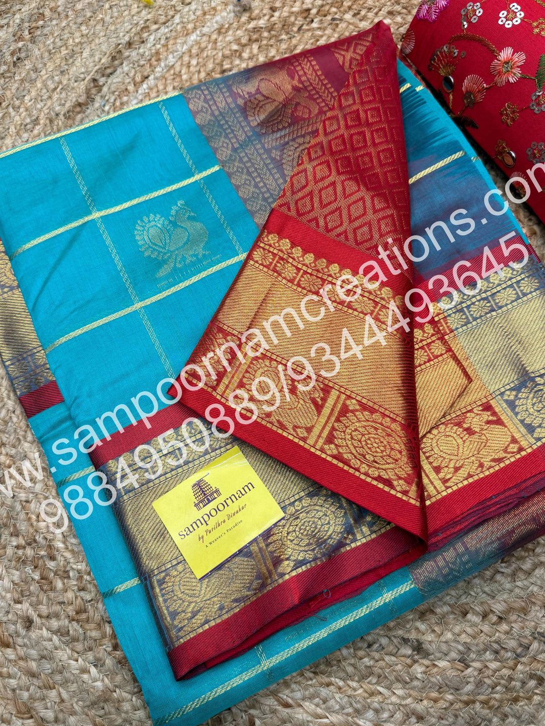 Rexona Green with Red , Rich Mayil and Chakram butta in the body with Zari Checks, traditional borders and Rich Pallu , Pure Silk Cotton Saree
