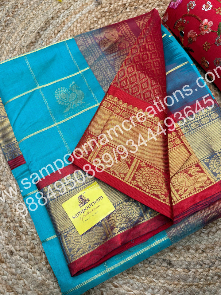 Rexona Green with Red , Rich Mayil and Chakram butta in the body with Zari Checks, traditional borders and Rich Pallu , Pure Silk Cotton Saree