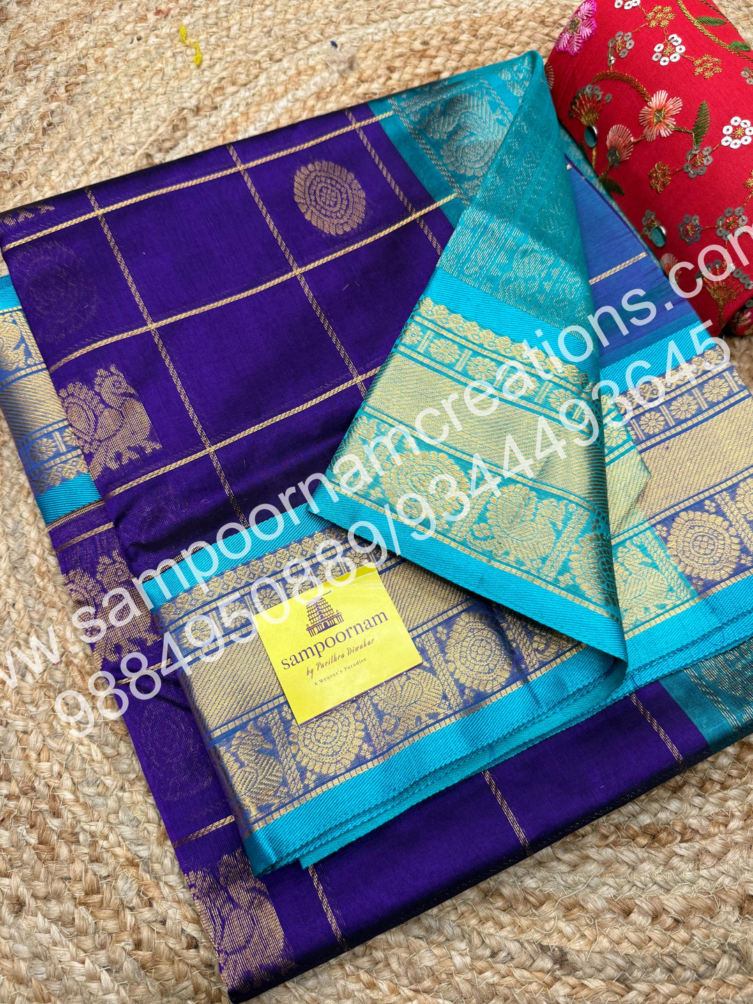 Violet with Turquoise Blue , Rich Mayil and Chakram butta in the body with Zari Checks, traditional borders and Rich Pallu , Pure Silk Cotton Saree