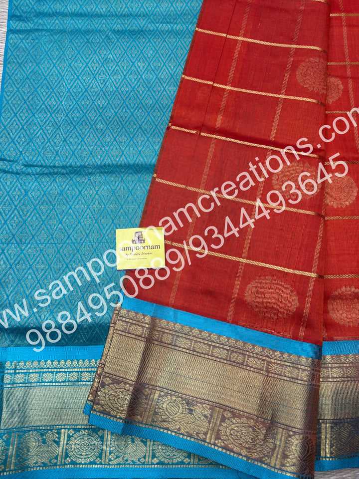 Red with Turquoise Blue , Rich Mayil and Chakram butta in the body with Zari Checks, traditional borders and Rich Pallu , Pure Silk Cotton Saree