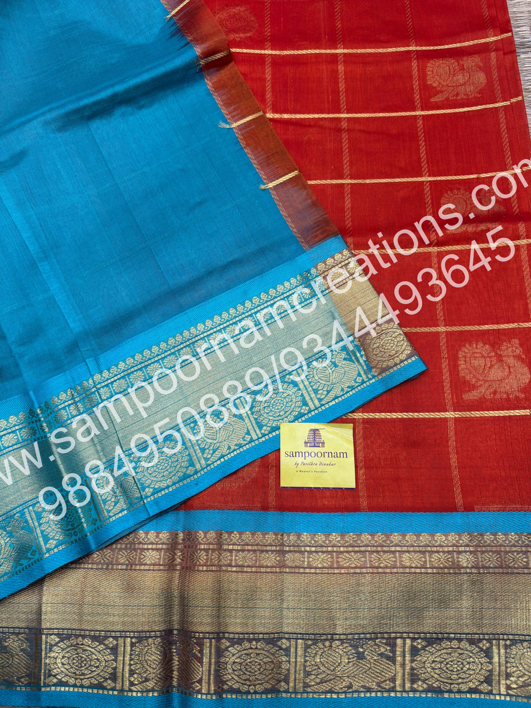 Rust Orange wuth Turquoise Blue , Rich Mayil and Chakram butta in the body with Zari Checks, traditional borders and Rich Pallu , Pure Silk Cotton Saree
