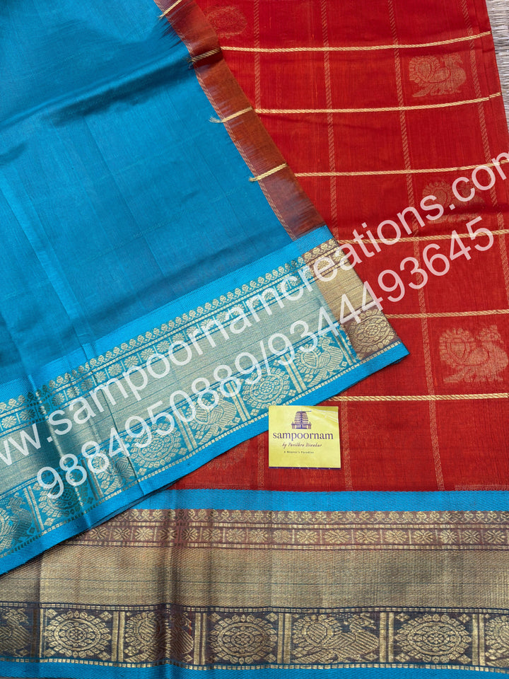 Rust Orange wuth Turquoise Blue , Rich Mayil and Chakram butta in the body with Zari Checks, traditional borders and Rich Pallu , Pure Silk Cotton Saree