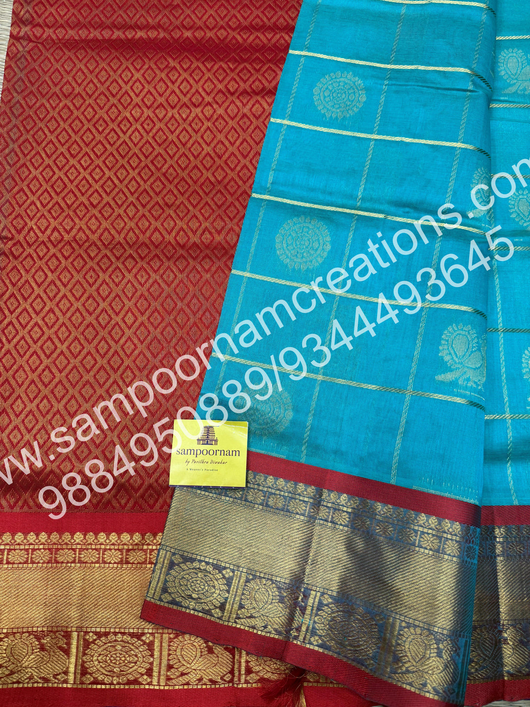 Rexona Green with Red , Rich Mayil and Chakram butta in the body with Zari Checks, traditional borders and Rich Pallu , Pure Silk Cotton Saree