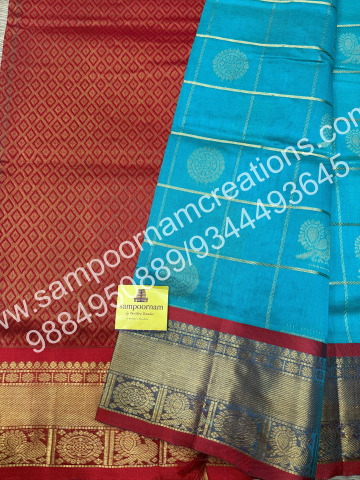 Rexona Green with Red , Rich Mayil and Chakram butta in the body with Zari Checks, traditional borders and Rich Pallu , Pure Silk Cotton Saree