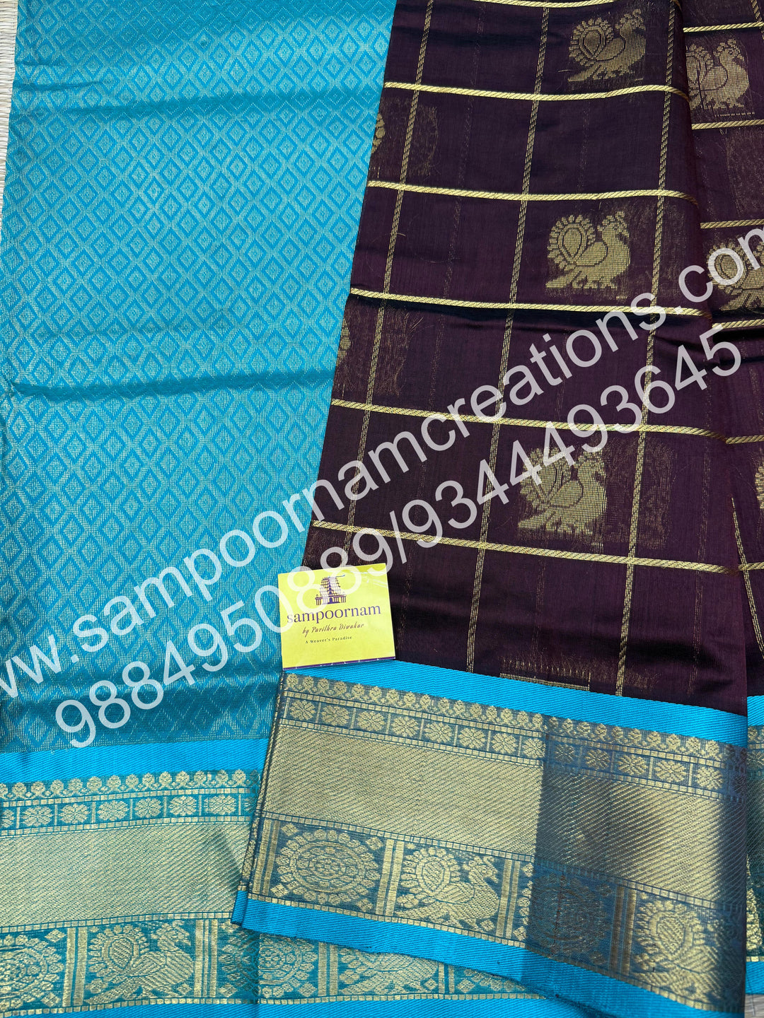 Dark Brown with Turquoise Blue , Rich Mayil and Chakram butta in the body with Zari Checks, traditional borders and Rich Pallu , Pure Silk Cotton Saree