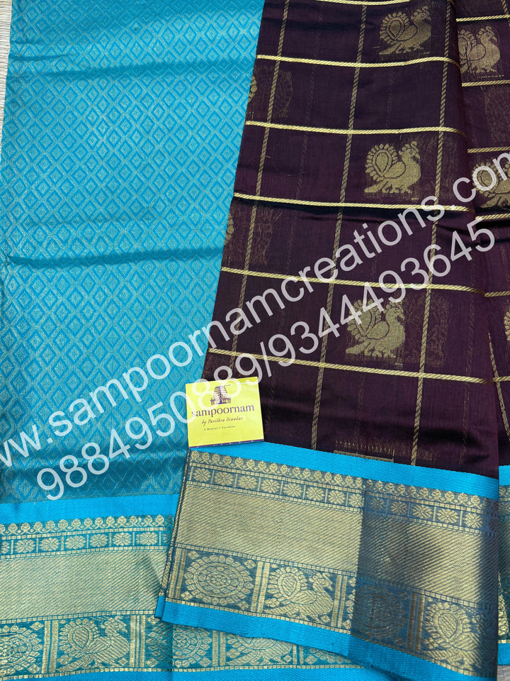 Dark Brown with Turquoise Blue , Rich Mayil and Chakram butta in the body with Zari Checks, traditional borders and Rich Pallu , Pure Silk Cotton Saree