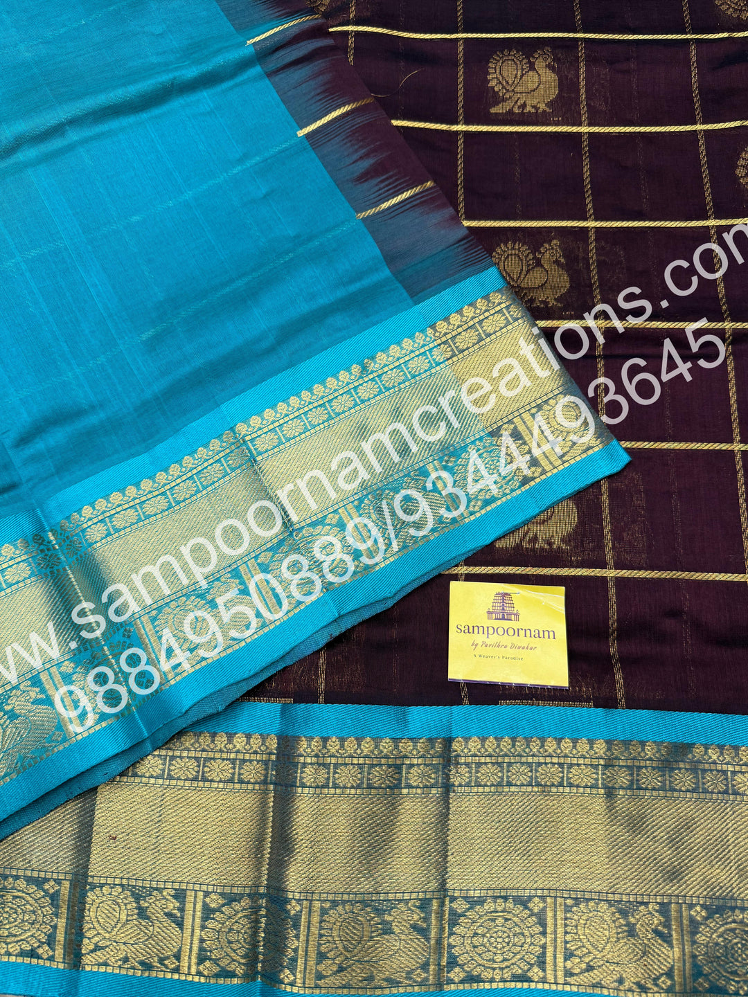 Dark Brown with Turquoise Blue , Rich Mayil and Chakram butta in the body with Zari Checks, traditional borders and Rich Pallu , Pure Silk Cotton Saree