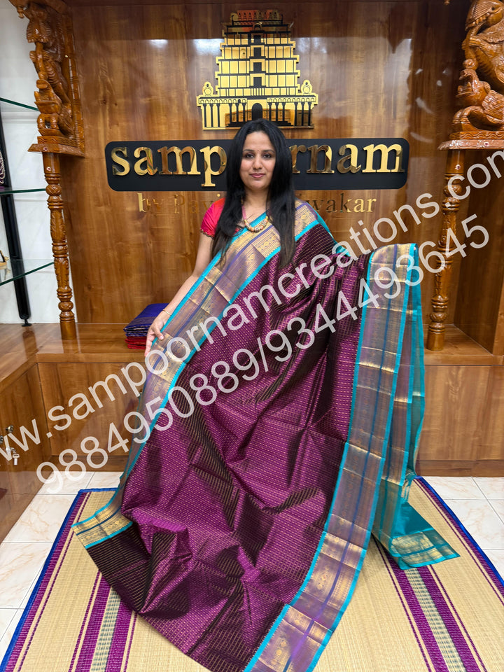 Wine with Turquoise Blue , Rich Traditional Borders and Lakshadeepam Zari Butta all over the body and Grand Pallu , Pure Silk Cotton Saree
