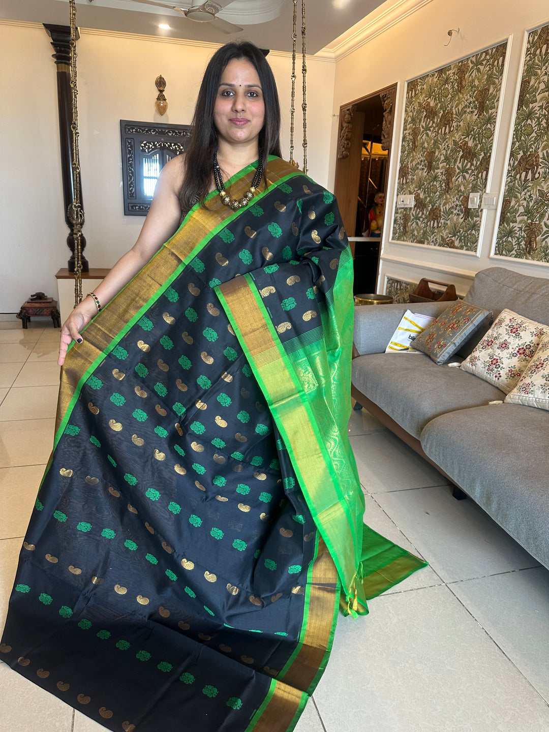 Black with green ,mango and annam rich butta in the body,traditional borders and rich pallu semi silk cotton saree