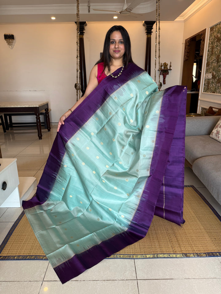 Ice Blue with Indigo, rich Rudraksha zari butta in the body and an elaborate rich Pallu Pure Soft Silk Saree
