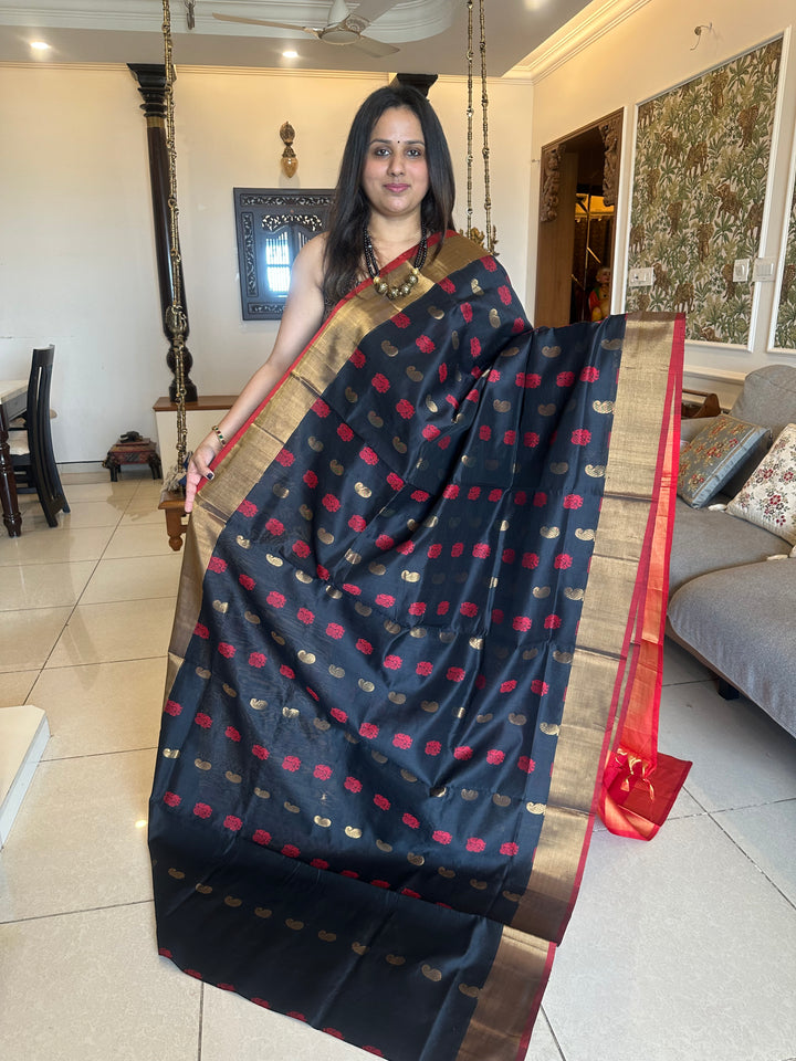 Black with red,mango and annam rich butta in the body,traditional borders and rich pallu semi silk cotton saree