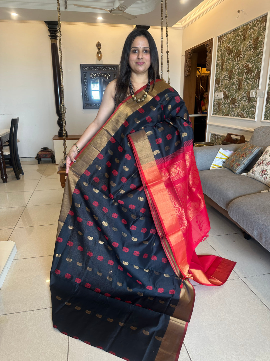 Black with red,mango and annam rich butta in the body,traditional borders and rich pallu semi silk cotton saree