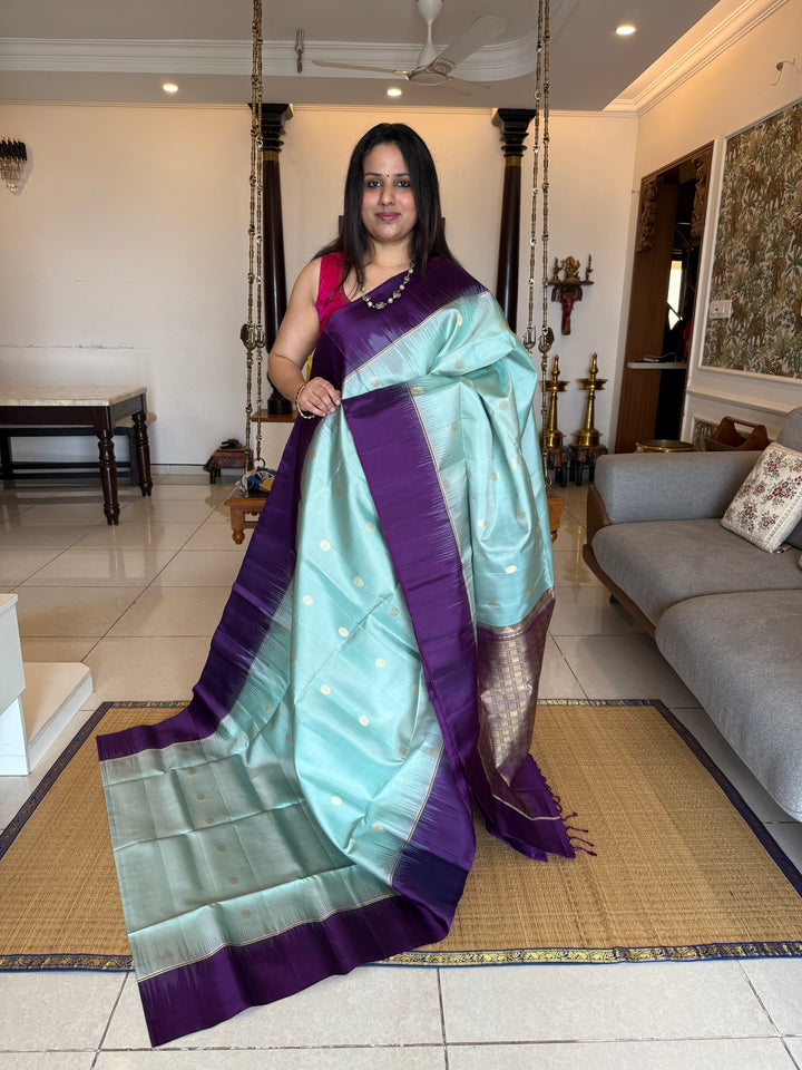 Ice Blue with Indigo, rich Rudraksha zari butta in the body and an elaborate rich Pallu Pure Soft Silk Saree