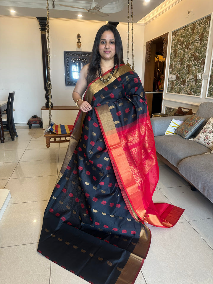 Black with red,mango and annam rich butta in the body,traditional borders and rich pallu semi silk cotton saree