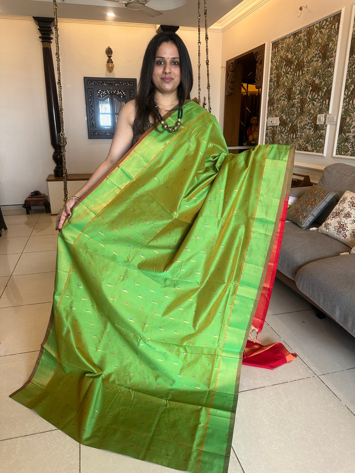 Green with red ,paithani inspried rich butta in the body,traditional borders and rich pallu semi silk cotton saree