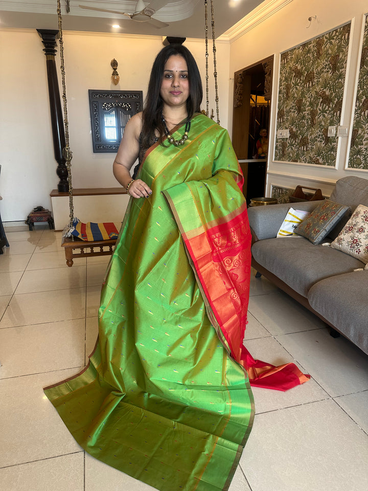 Green with red ,paithani inspried rich butta in the body,traditional borders and rich pallu semi silk cotton saree