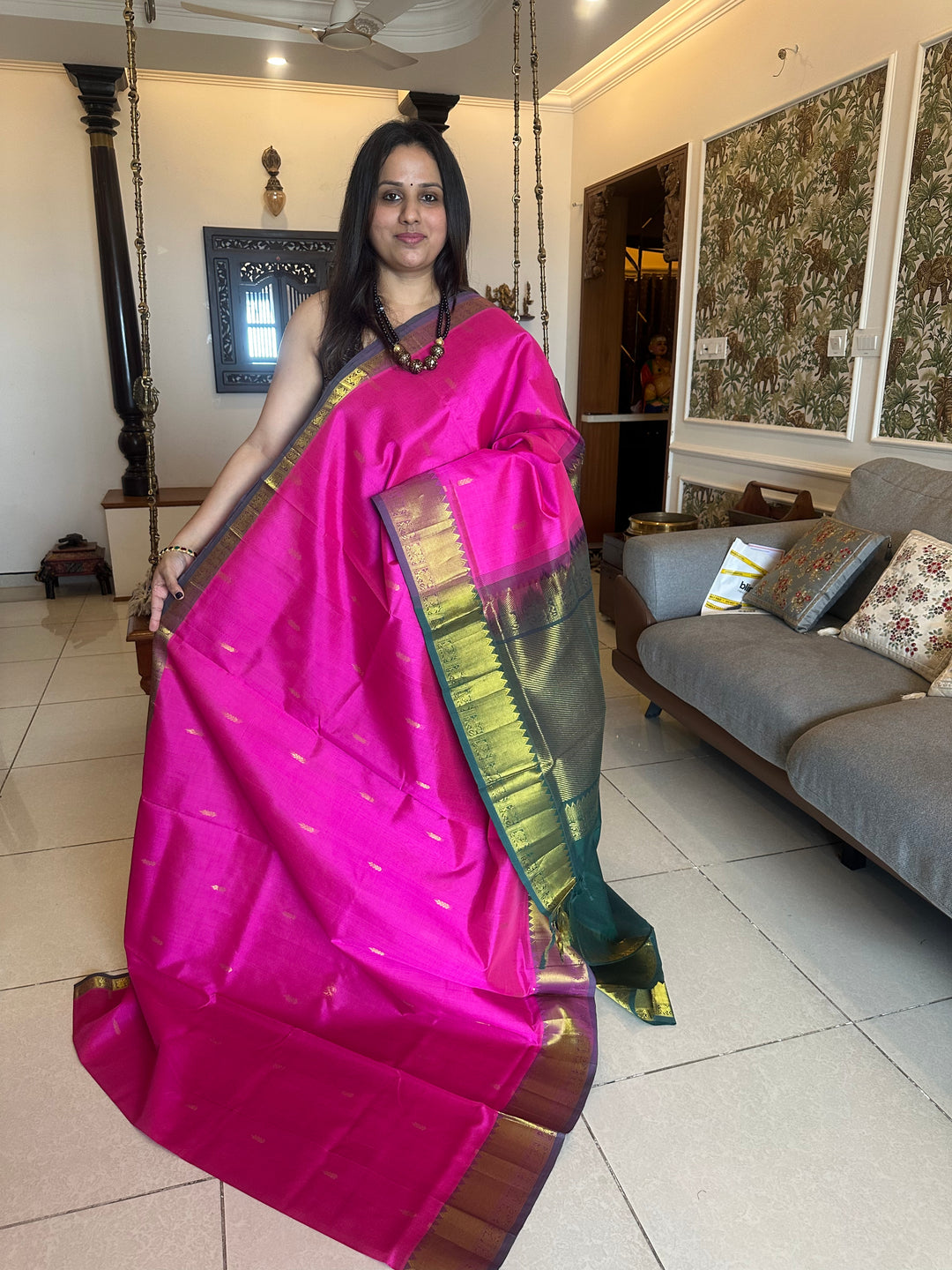 Green with pink rich butta in the body,traditional borders and rich pallu semi silk cotton saree