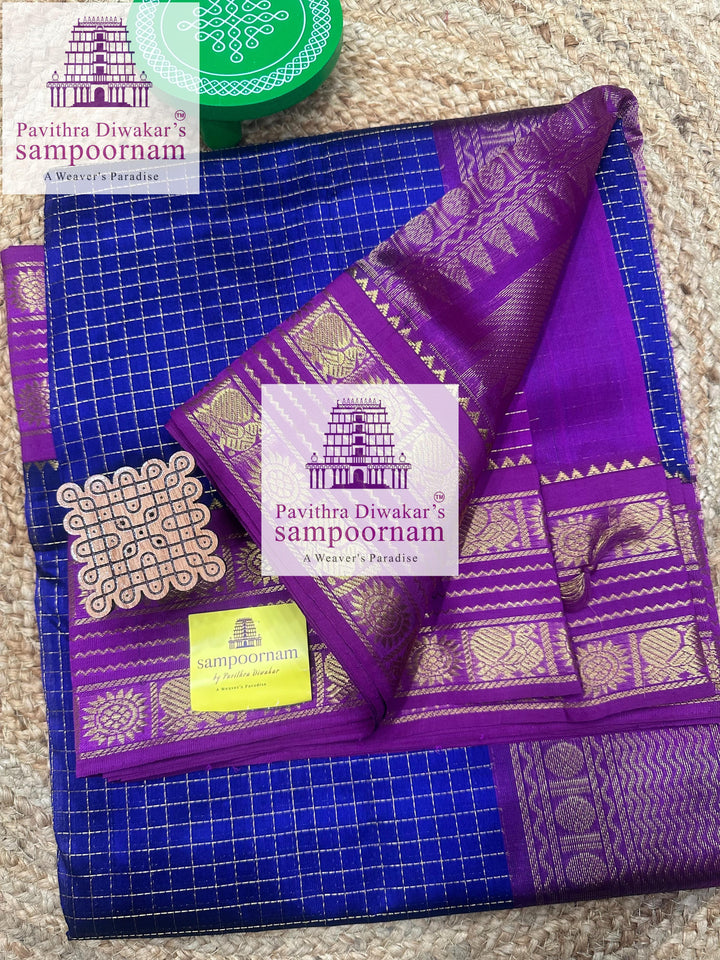 Blue with Purple , Zari checks in the body , traditional rettapet border and rich Pallu Korvai Silk Cotton Saree
