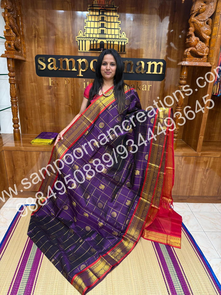 Wine with Red , Rich Mayil and Chakram butta in the body with Zari Checks, traditional borders and Rich Pallu , Pure Silk Cotton Saree