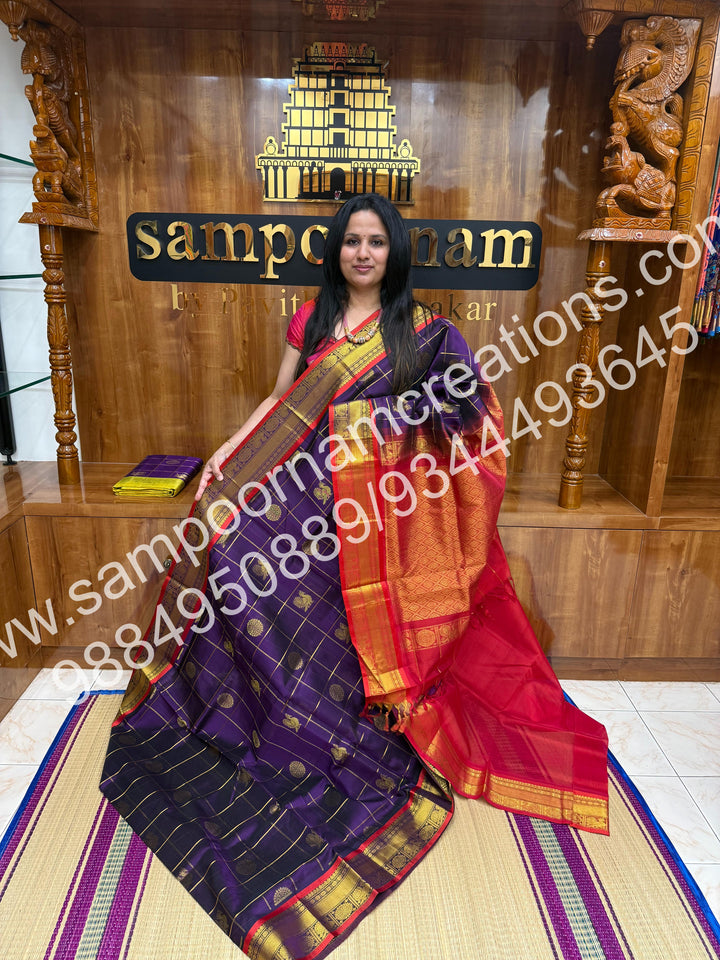 Wine with Red , Rich Mayil and Chakram butta in the body with Zari Checks, traditional borders and Rich Pallu , Pure Silk Cotton Saree