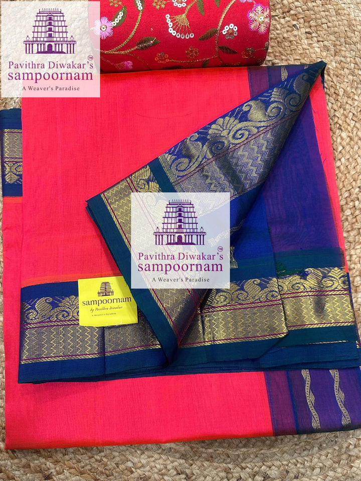 Dark Orangish Pink with Mayilkazhuthu , rich Zari butta in the body , traditional borders and rich Pallu Korvai Silk Cotton Saree